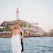 elopement couple on wedding day near lighthouse
