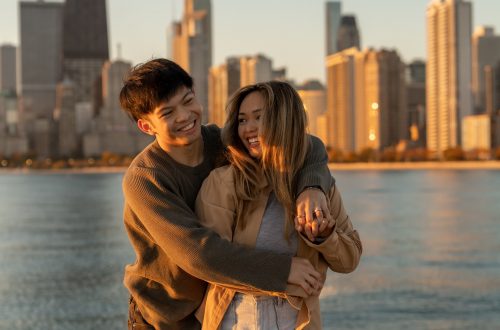 couple hugging on engagement session golden hour