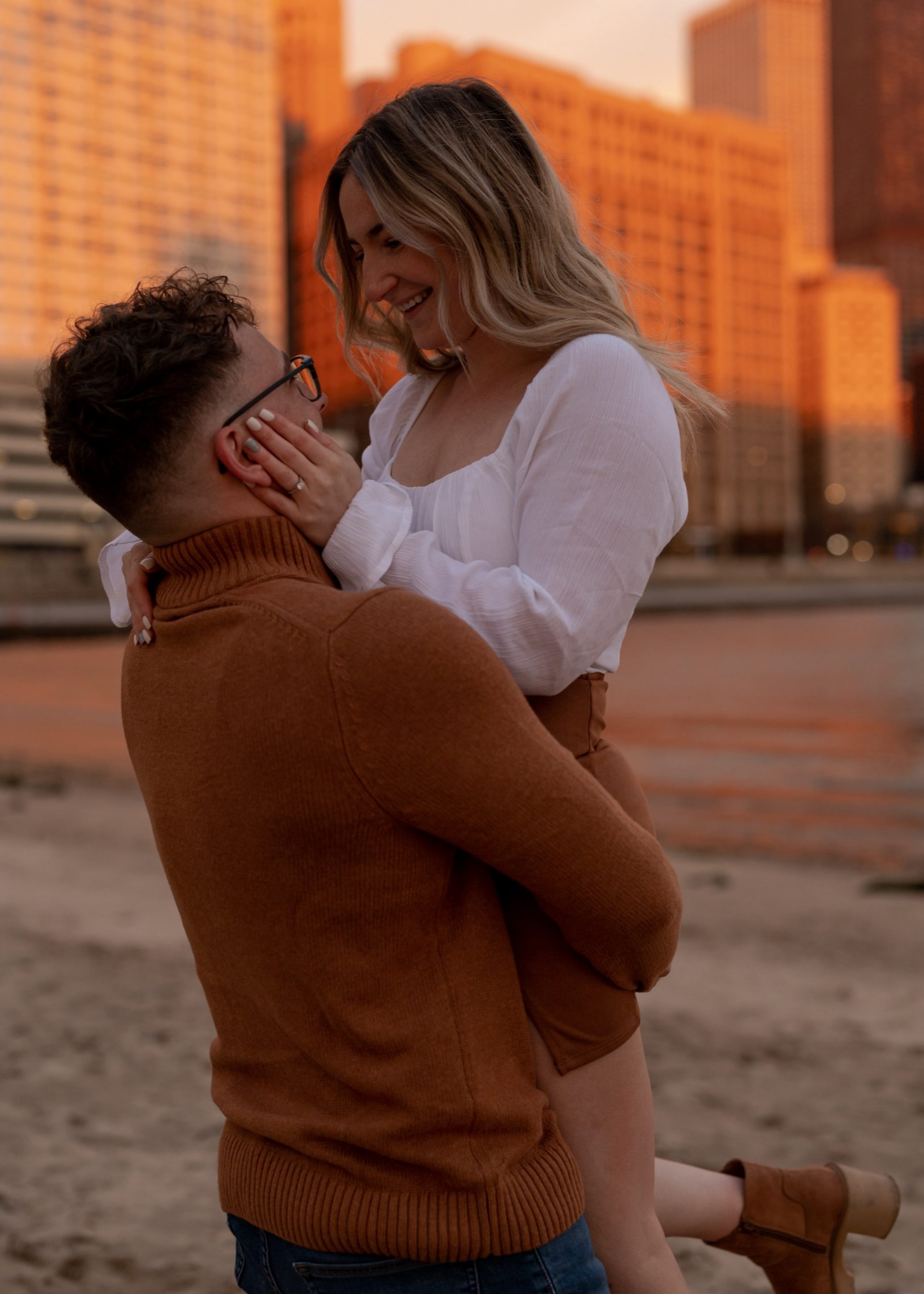 couple holding each other on beach